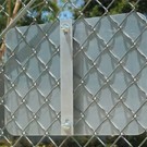 Chain link fence sign bracket